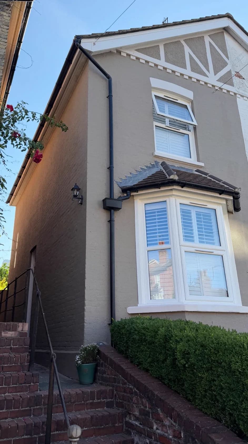 House exterior repainted in warm stone – after